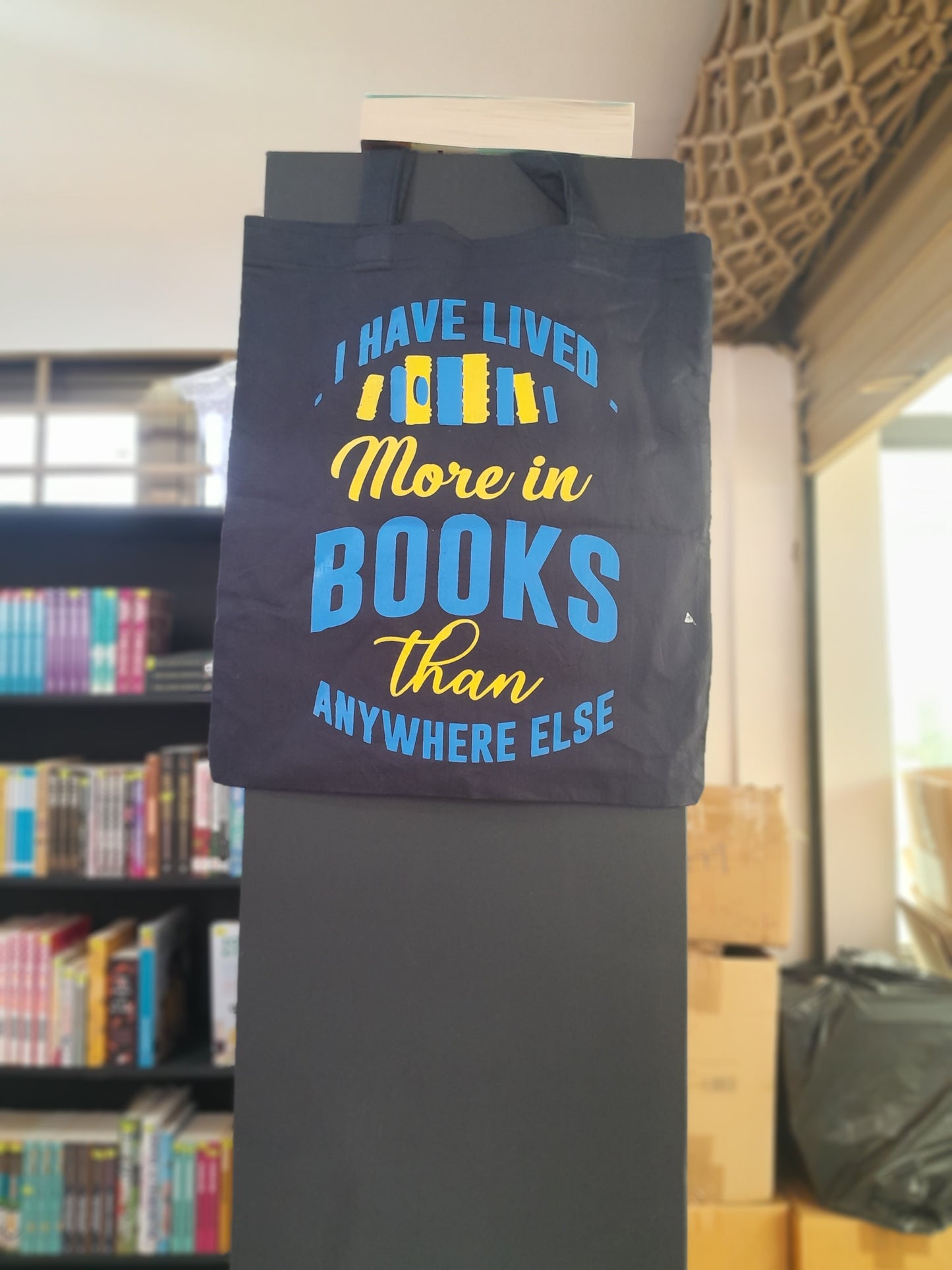 I have lived in books more anywhere else Tote bag