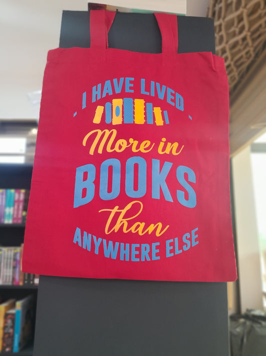 I have lived in books more anywhere else Tote bag